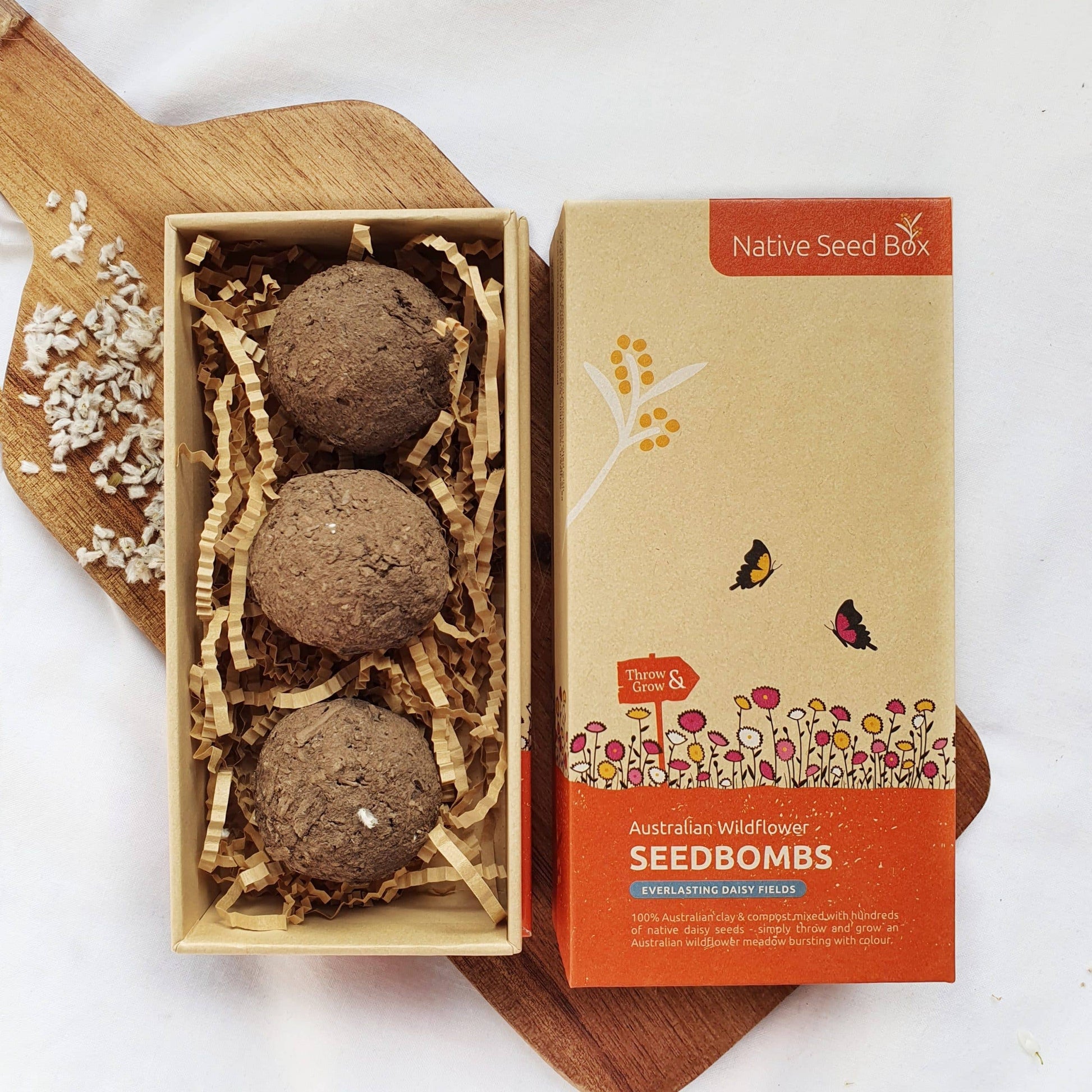 Roll of clay and compost with Everlasting Daisy seeds