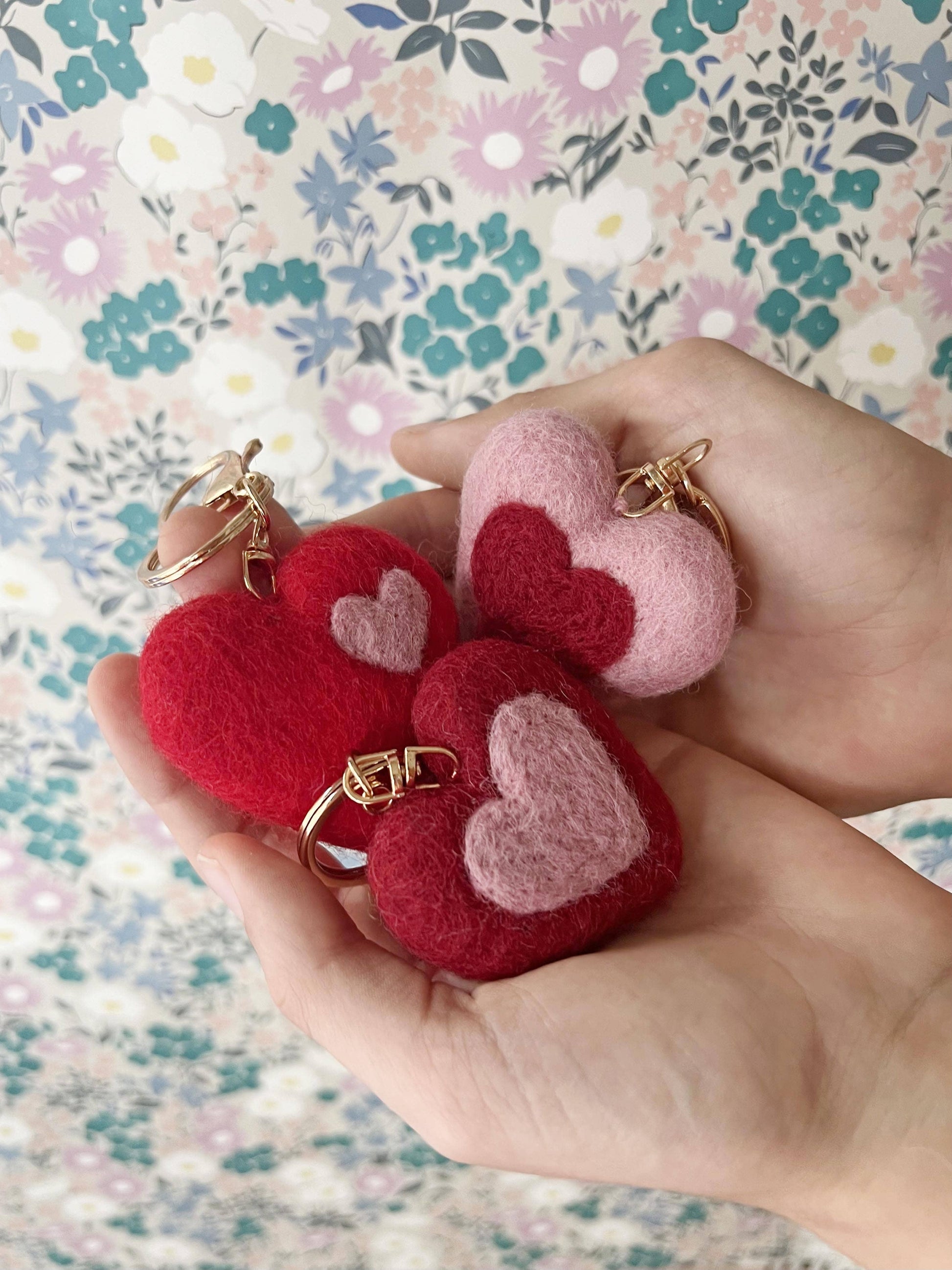 Soft wool felt bag charm in red, deep red, and pink