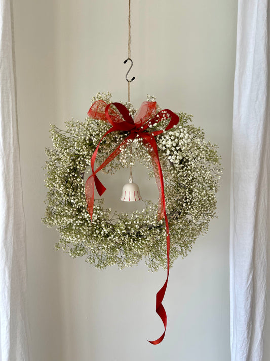 Baby’s breath full wreath, with classic bell and Ruby red ribbon